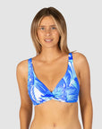 Woman wearing a blue and white patterned bikini top for big bust in style Kokomo by brand Baku front view