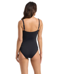 Woman wearing black floral one piece swimsuit for big busts in style Watermist by brand Janzten back view