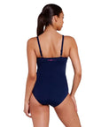 Women wearing Kuringai Ruched Front One Piece swimsuit in navy with floral ruched front panel for C-E cup bust size in chlorine resistant eco sensitive fabric with good coverage by swim brand Zoggs with white background back view