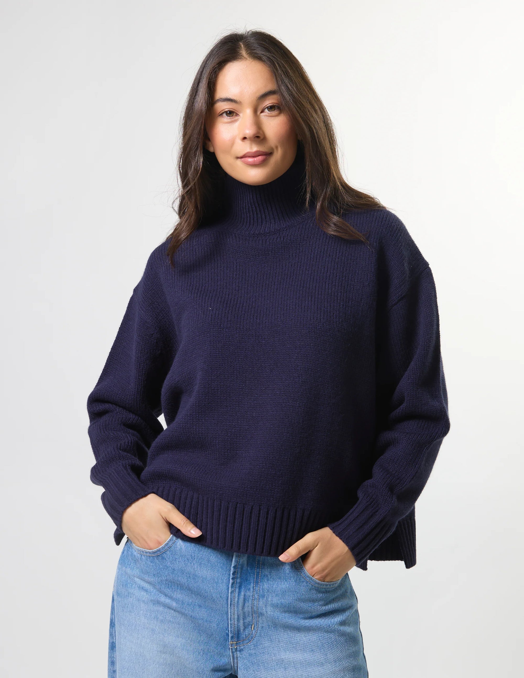 Woman wearing mixed wool navy jumper with turtleneck by brand Stella & Gemma front view